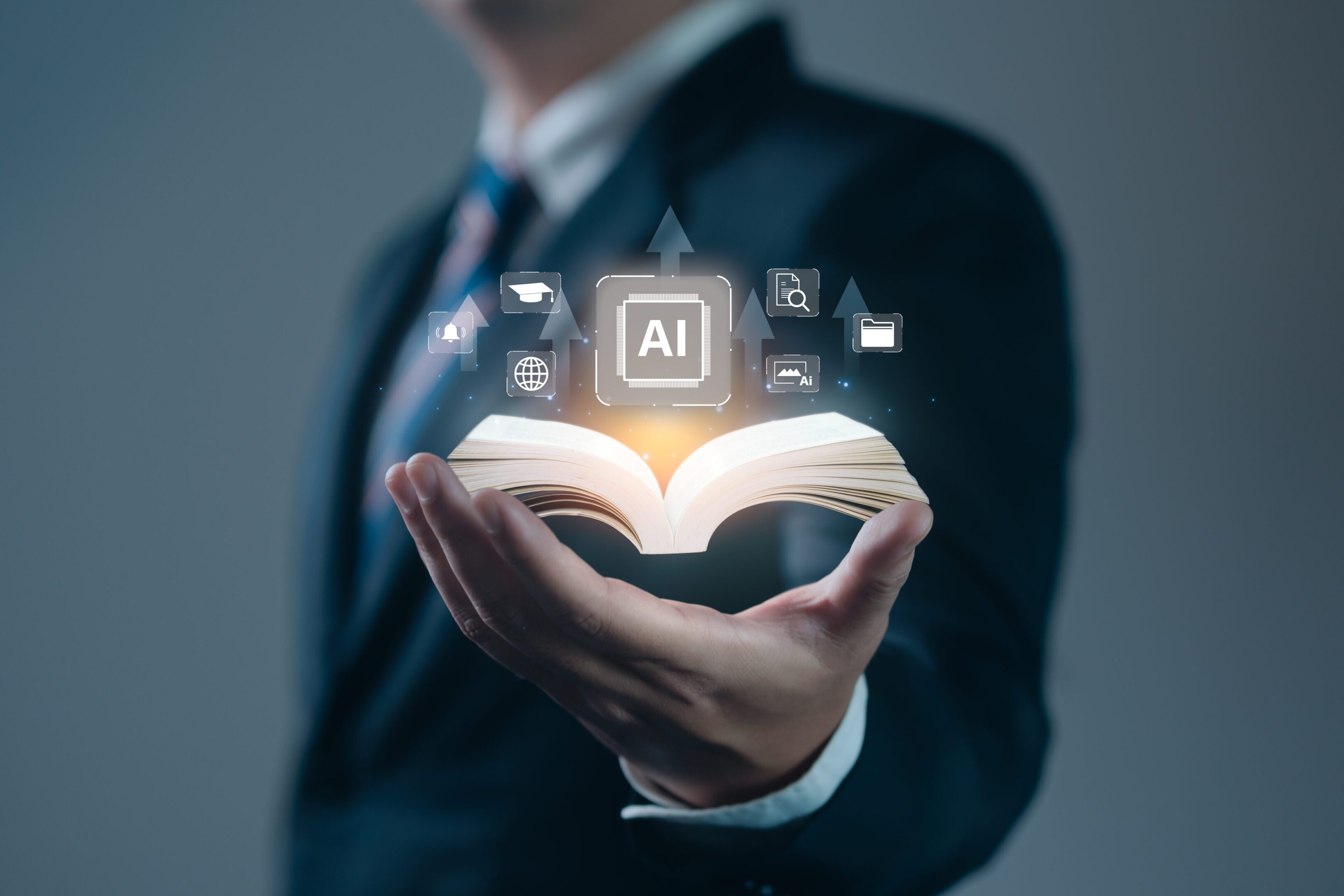 Businessman holding digital book with AI icons.