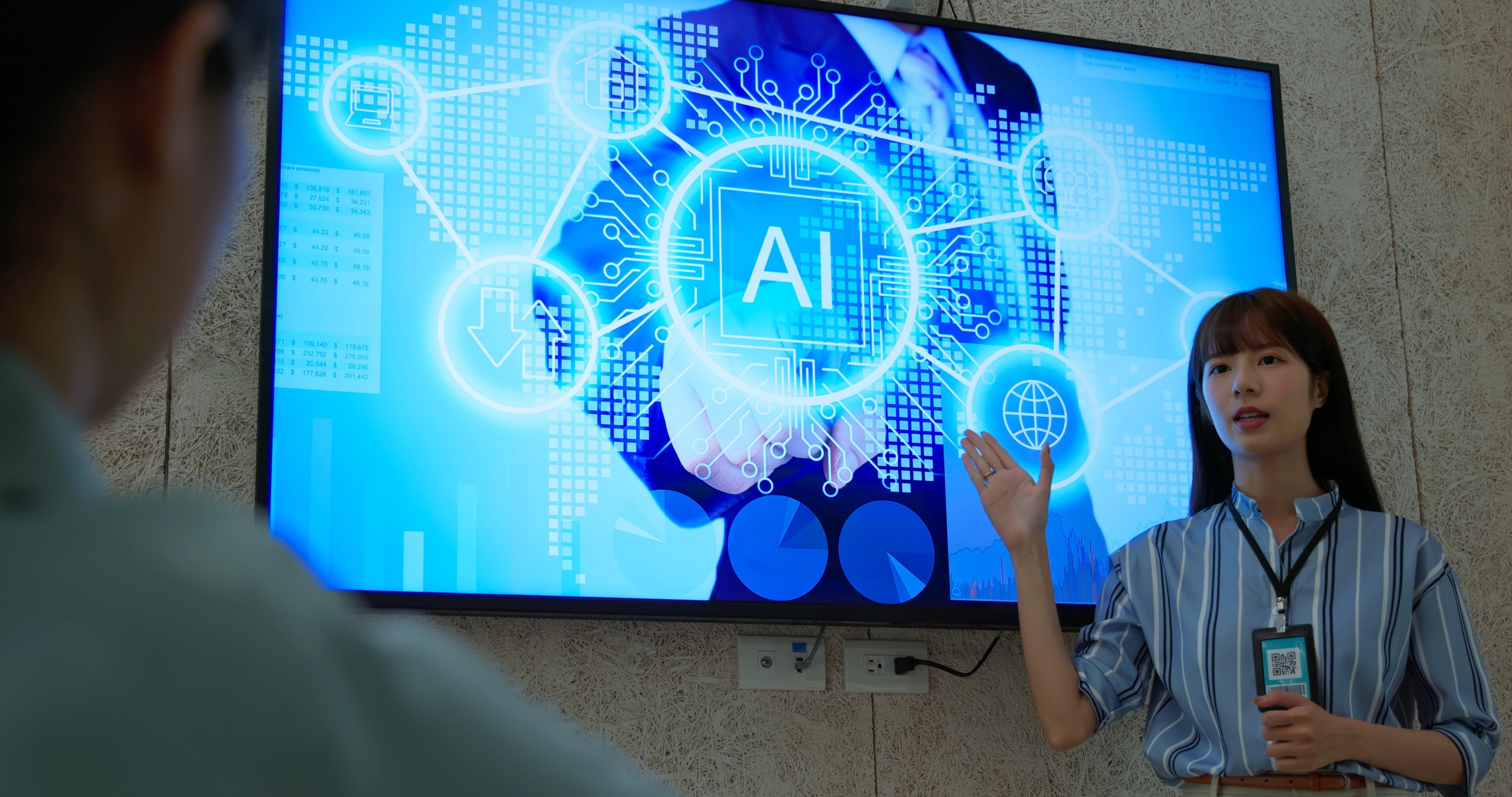 Person presenting AI technology on screen.